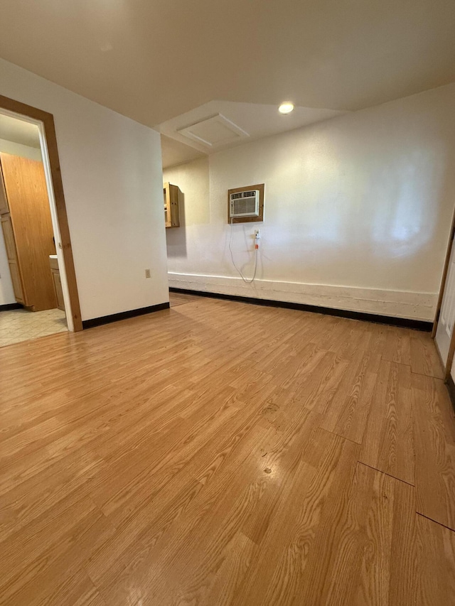 5890 Missouri Ln, Anderson, CA 96007 - empty room with a wall mounted air conditioner, light wood-type flooring, baseboards, and recessed lighting