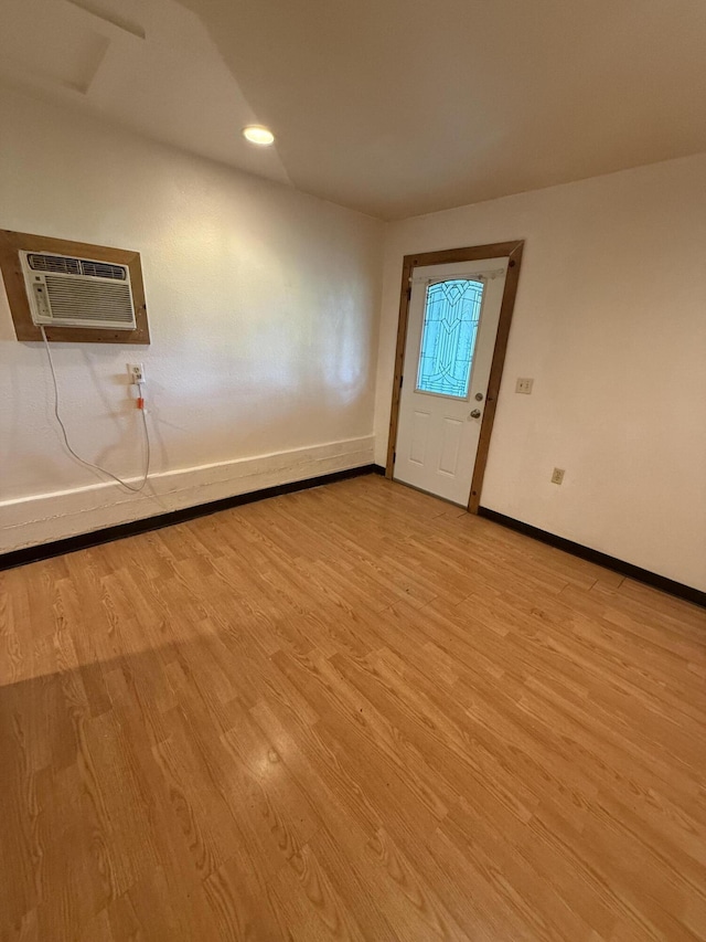 5890 Missouri Ln, Anderson, CA 96007 - foyer with baseboards, light wood-style flooring, a wall mounted air conditioner, and recessed lighting