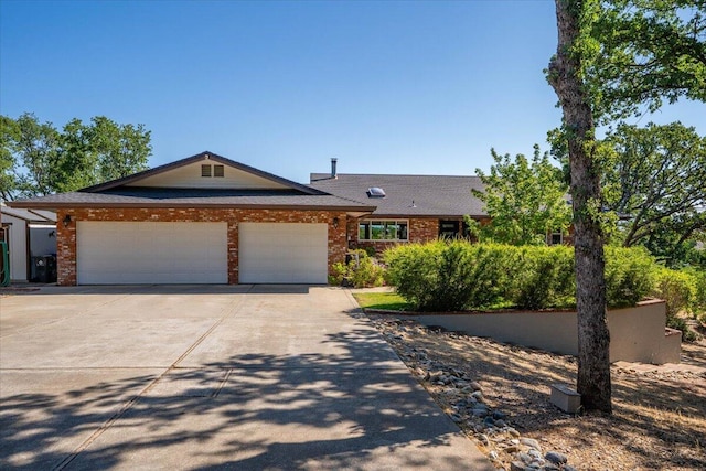 21350 Wilcox Rd, Red Bluff, CA 96080 - view of front of house with driveway, an attached garage, and brick siding