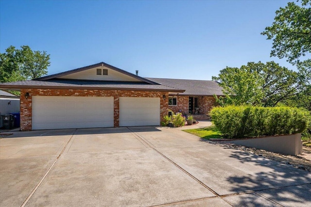 21350 Wilcox Rd, Red Bluff, CA 96080 - ranch-style house with driveway, a garage, and brick siding