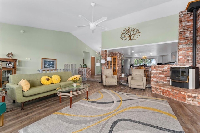 21350 Wilcox Rd, Red Bluff, CA 96080 - living area featuring wood finished floors, high vaulted ceiling, ceiling fan, and a wood stove