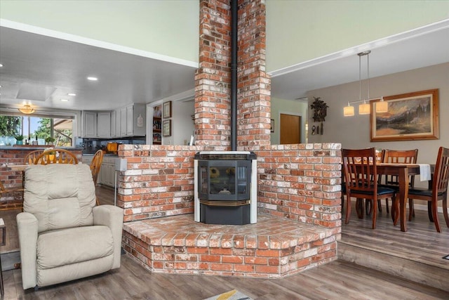 21350 Wilcox Rd, Red Bluff, CA 96080 - living room with a wood stove, wood finished floors, and recessed lighting