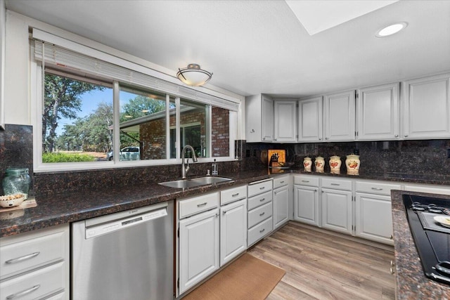 21350 Wilcox Rd, Red Bluff, CA 96080 - kitchen with dishwasher, a sink, decorative backsplash, stovetop with downdraft, and recessed lighting