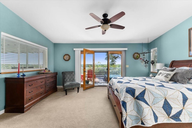 21350 Wilcox Rd, Red Bluff, CA 96080 - bedroom featuring access to exterior, light colored carpet, multiple windows, and baseboards