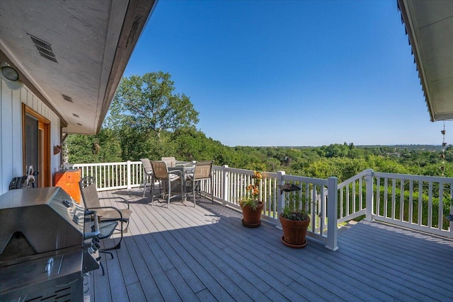 21350 Wilcox Rd, Red Bluff, CA 96080 - wooden deck featuring outdoor dining space, grilling area, and a forest view