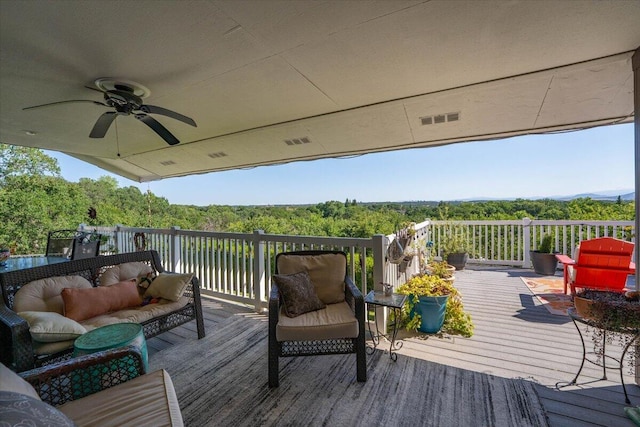 21350 Wilcox Rd, Red Bluff, CA 96080 - wooden deck featuring an outdoor living space, a ceiling fan, and a view of trees