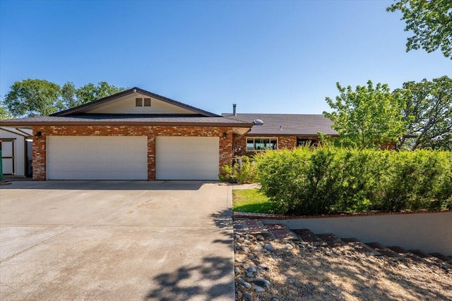 21350 Wilcox Rd, Red Bluff, CA 96080 - single story home featuring a garage, driveway, and brick siding