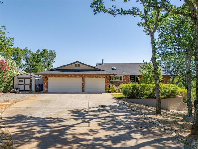 21350 Wilcox Rd, Red Bluff, CA 96080 - ranch-style house featuring concrete driveway, brick siding, and a garage