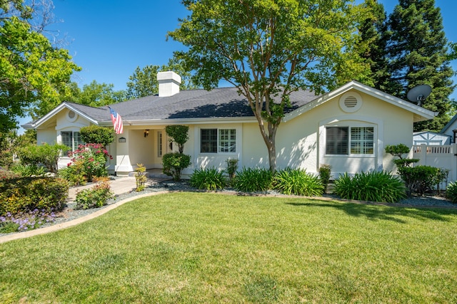 3811 Andes Dr, Redding, CA 96001 - ranch-style home featuring stucco siding, a chimney, and a front lawn