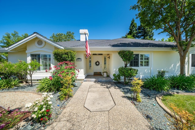 3811 Andes Dr, Redding, CA 96001 - single story home featuring stucco siding, a chimney, a porch, and roof with shingles