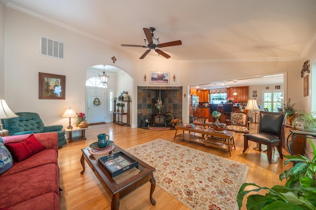 3811 Andes Dr, Redding, CA 96001 - living room featuring arched walkways, ceiling fan, plenty of natural light, crown molding, and light wood-style floors