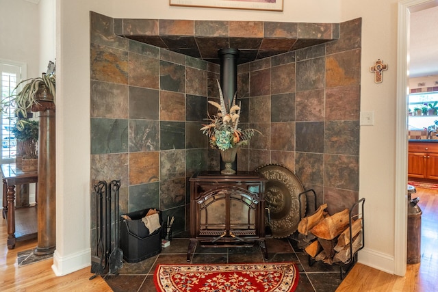 3811 Andes Dr, Redding, CA 96001 - detailed view of a wood stove, wood finished floors, and baseboards