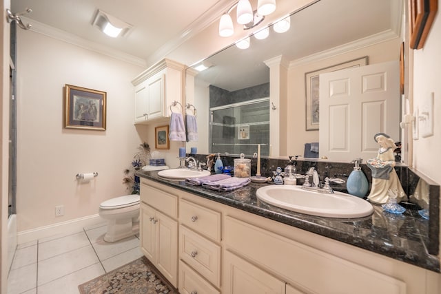 3811 Andes Dr, Redding, CA 96001 - full bath with double vanity, toilet, ornamental molding, tile patterned flooring, and baseboards