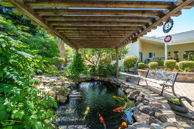 3811 Andes Dr, Redding, CA 96001 - view of yard featuring a small pond, a patio, and a pergola