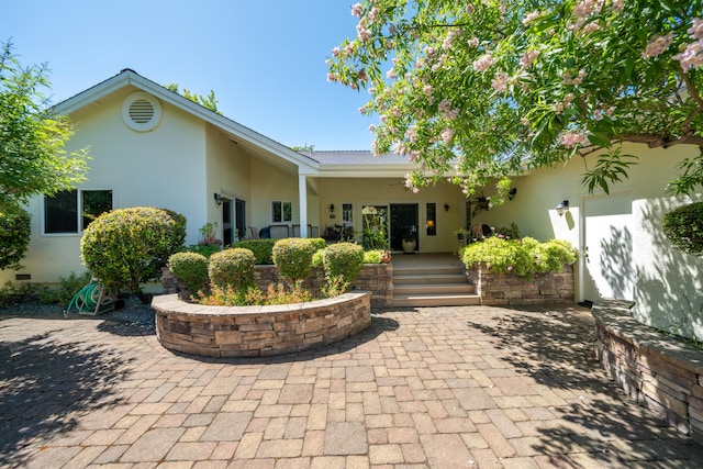 3811 Andes Dr, Redding, CA 96001 - view of front of home with stucco siding and a patio area