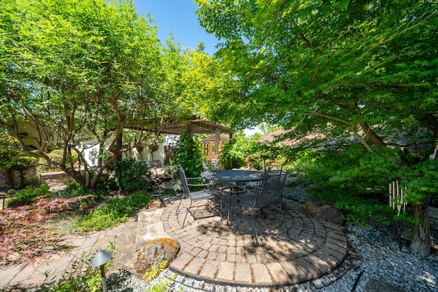 3811 Andes Dr, Redding, CA 96001 - view of patio / terrace with a pergola and outdoor dining area