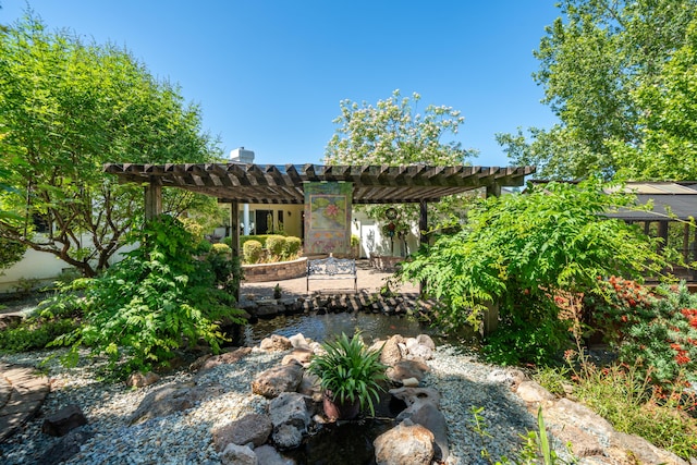 3811 Andes Dr, Redding, CA 96001 - view of patio featuring a garden pond and a pergola