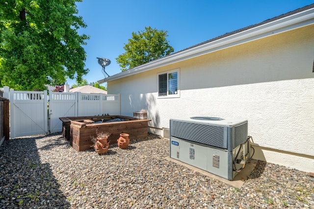 3811 Andes Dr, Redding, CA 96001 - view of yard featuring a gate and central AC unit