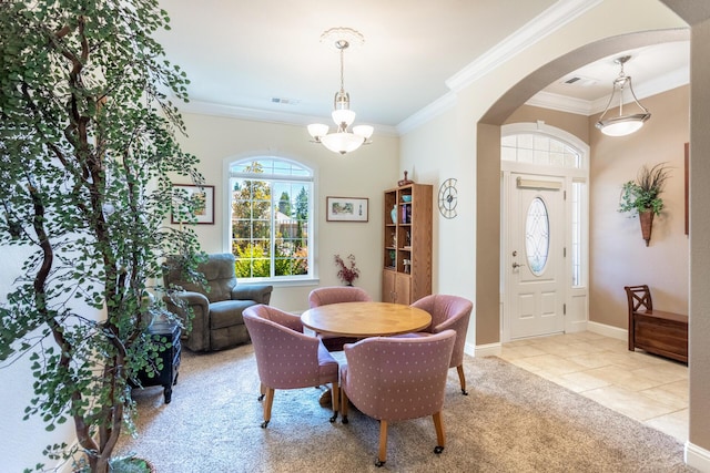 2830 Montana Sky Dr, Redding, CA 96002 - dining room featuring arched walkways, ornamental molding, a chandelier, tile patterned floors, and baseboards