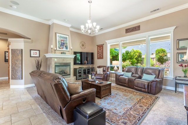 2830 Montana Sky Dr, Redding, CA 96002 - living area featuring baseboards, arched walkways, a chandelier, ornamental molding, and a tiled fireplace