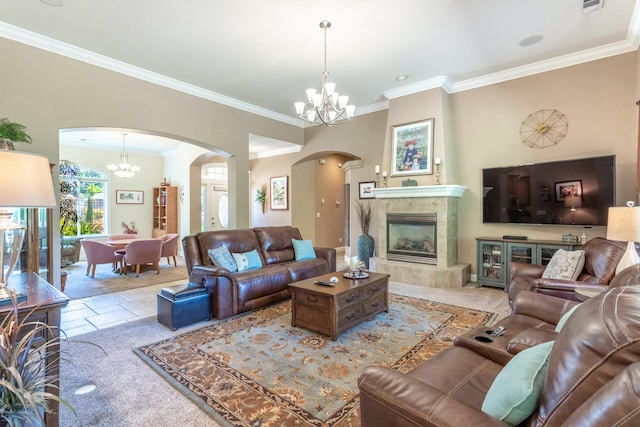 2830 Montana Sky Dr, Redding, CA 96002 - living room with arched walkways, a chandelier, ornamental molding, and a fireplace
