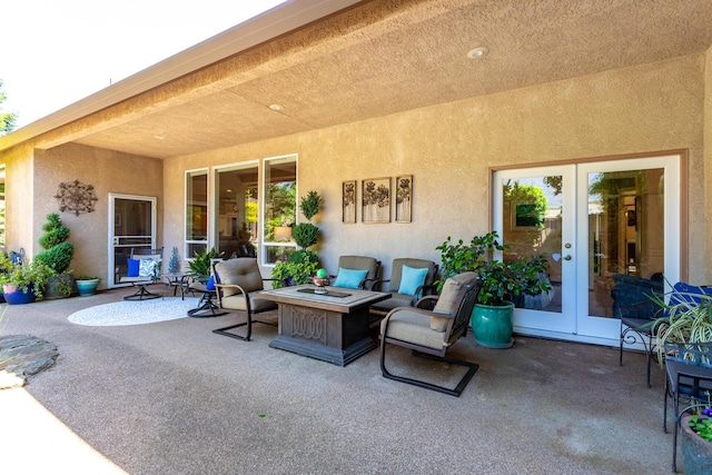 2830 Montana Sky Dr, Redding, CA 96002 - view of patio featuring french doors and an outdoor fire pit
