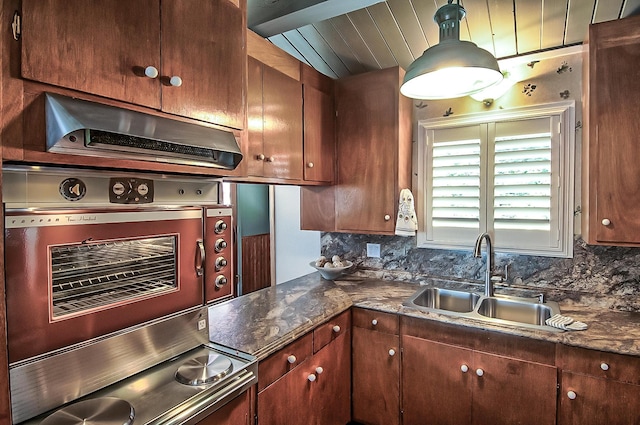 19370 Mountain Maple Rd, Lakehead, CA 96051 - kitchen featuring a sink, tasteful backsplash, and hanging light fixtures