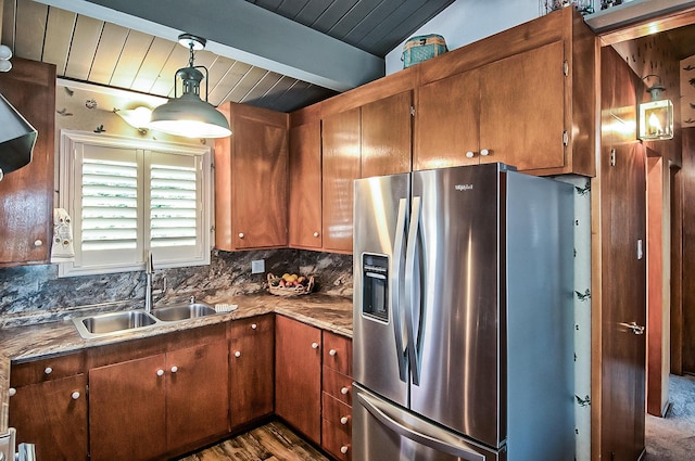 19370 Mountain Maple Rd, Lakehead, CA 96051 - kitchen with stainless steel fridge, a sink, wood ceiling with exposed beams, decorative backsplash, and brown cabinetry