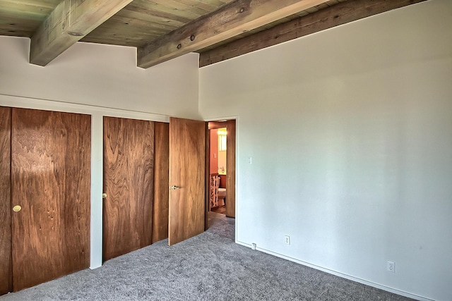 19370 Mountain Maple Rd, Lakehead, CA 96051 - unfurnished bedroom featuring carpet flooring, two closets, wood ceiling with exposed beams, and a high ceiling