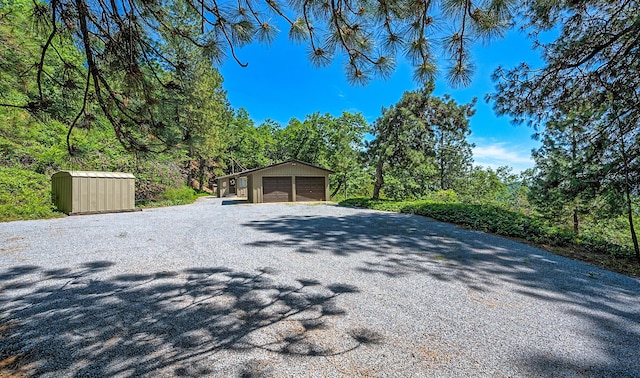 19370 Mountain Maple Rd, Lakehead, CA 96051 - detached garage with gravel driveway and a storage shed