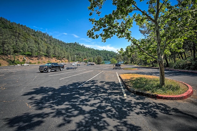 19370 Mountain Maple Rd, Lakehead, CA 96051 - view of asphalt road with a view of trees and curbs