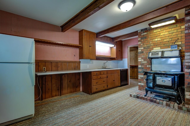2915 Rockabye Ln, Redding, CA 96002 - kitchen with freestanding refrigerator, a sink, light colored carpet, beam ceiling, and light countertops