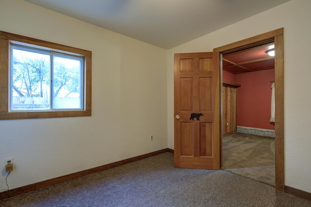 2915 Rockabye Ln, Redding, CA 96002 - unfurnished bedroom with carpet flooring, lofted ceiling, baseboards, a closet, and a spacious closet