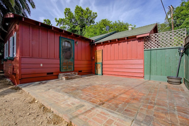 2915 Rockabye Ln, Redding, CA 96002 - view of front of home featuring board and batten siding, crawl space, and a patio