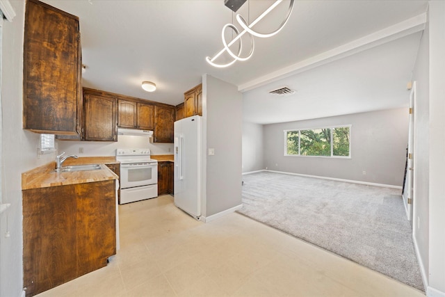 2190 Skyline Dr, Redding, CA 96001 - kitchen featuring white appliances, a sink, range hood, light carpet, and open floor plan