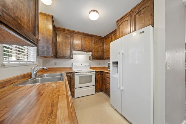 2190 Skyline Dr, Redding, CA 96001 - kitchen with white appliances, under cabinet range hood, a sink, butcher block counters, and light floors