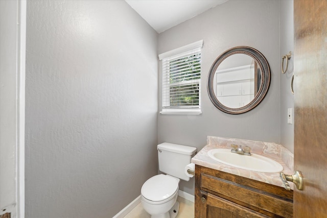 2190 Skyline Dr, Redding, CA 96001 - half bathroom with toilet, vanity, and baseboards