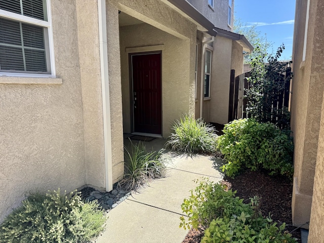 2135 Vienna Way, Redding, CA 96003 - doorway to property featuring stucco siding
