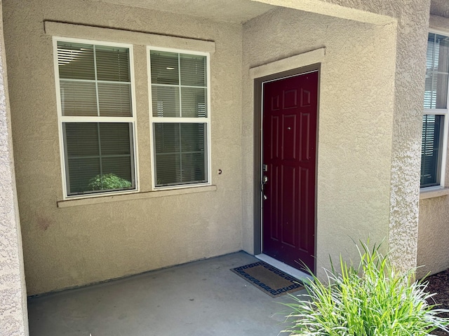 2135 Vienna Way, Redding, CA 96003 - doorway to property featuring stucco siding