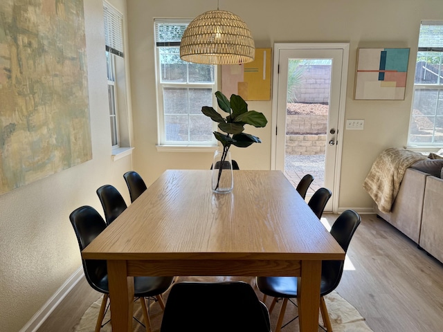 2135 Vienna Way, Redding, CA 96003 - dining room with baseboards, wood finished floors, and healthy amount of natural light
