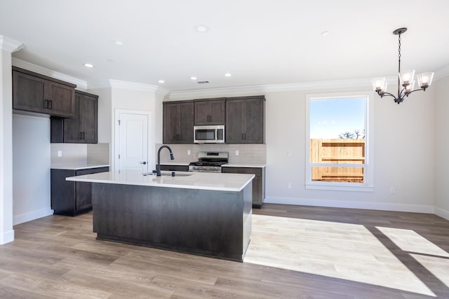 20171 Solomon Peak Dr Lot 20, Anderson, CA 96007 - kitchen with stainless steel appliances, a sink, ornamental molding, dark brown cabinets, and decorative backsplash