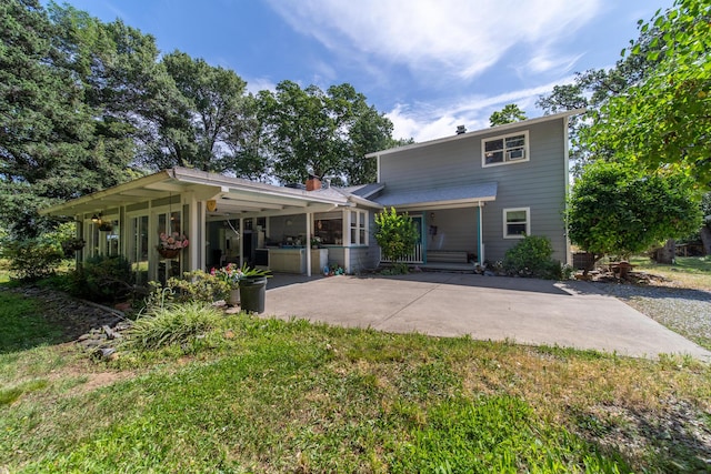 2940 Felstet Ln, Redding, CA 96001 - rear view of property with concrete driveway and covered porch
