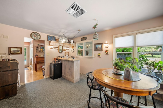 2940 Felstet Ln, Redding, CA 96001 - dining room featuring light colored carpet and a chandelier