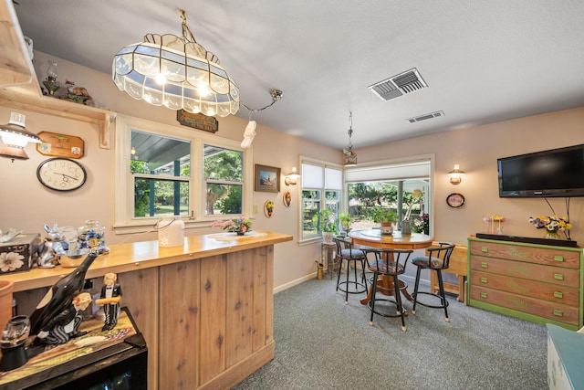 2940 Felstet Ln, Redding, CA 96001 - kitchen featuring wood counters and carpet floors