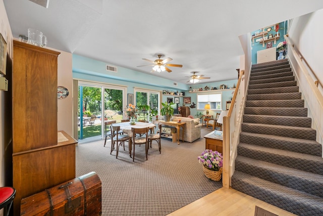 2940 Felstet Ln, Redding, CA 96001 - living room with stairs, a ceiling fan, wood finished floors, and carpet floors