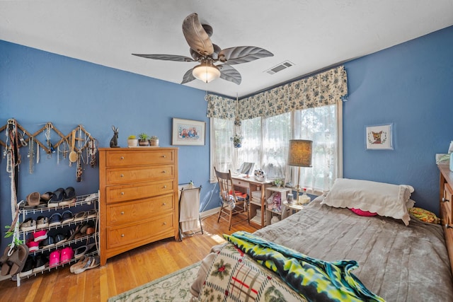 2940 Felstet Ln, Redding, CA 96001 - bedroom with wood finished floors and a ceiling fan