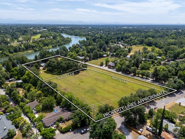 2940 Felstet Ln, Redding, CA 96001 - aerial view of property and surrounding area with property boundaries highlighted and a large body of water