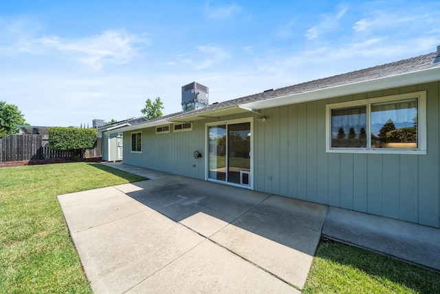 1626 French Lace Ln, Redding, CA 96003 - back of house featuring central AC unit, a patio area, and a chimney
