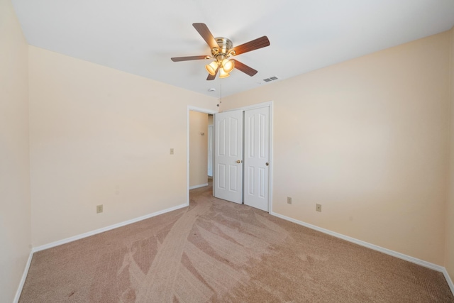1626 French Lace Ln, Redding, CA 96003 - unfurnished bedroom with carpet, baseboards, a closet, and ceiling fan