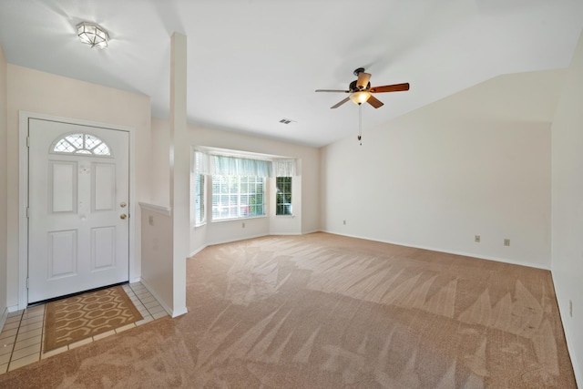 1626 French Lace Ln, Redding, CA 96003 - entrance foyer with carpet floors, healthy amount of natural light, a ceiling fan, baseboards, and vaulted ceiling